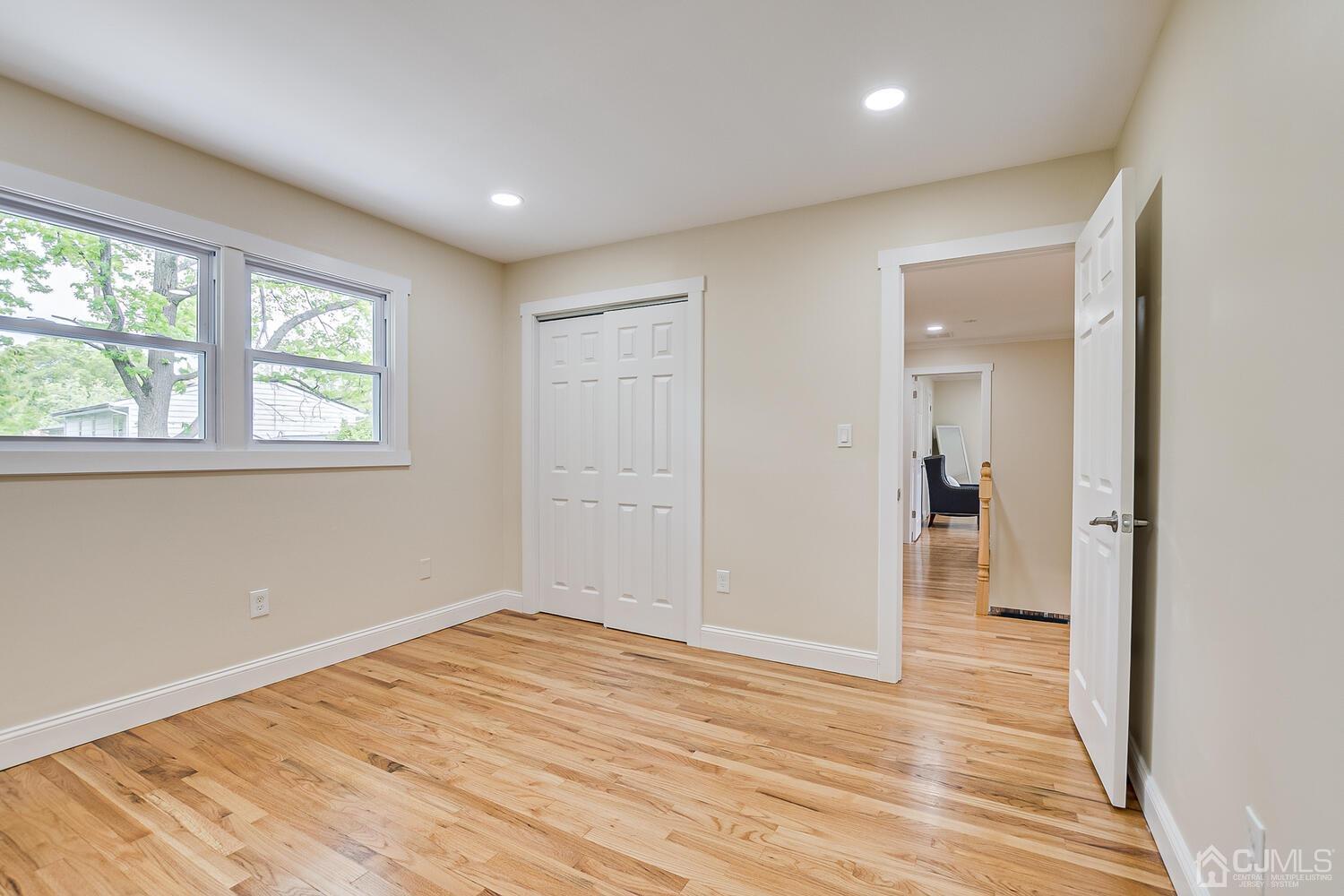 2 Devon Road Edison, NJ 08820 - Photo 55 of 69 a view of empty room with wooden floor
