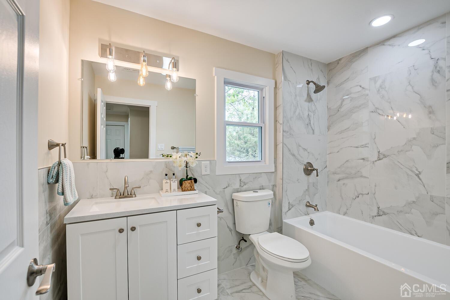 2 Devon Road Edison, NJ 08820 - Photo 56 of 69 a bathroom with a sink toilet tub and shower