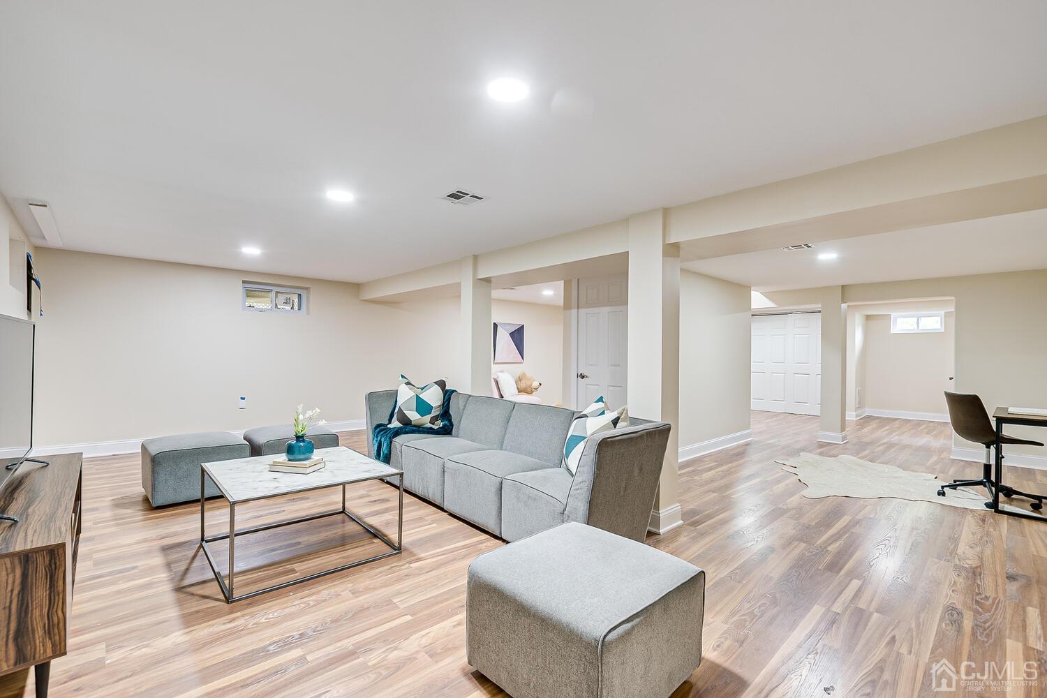 2 Devon Road Edison, NJ 08820 - Photo 60 of 69 a living room with furniture and a wooden floor