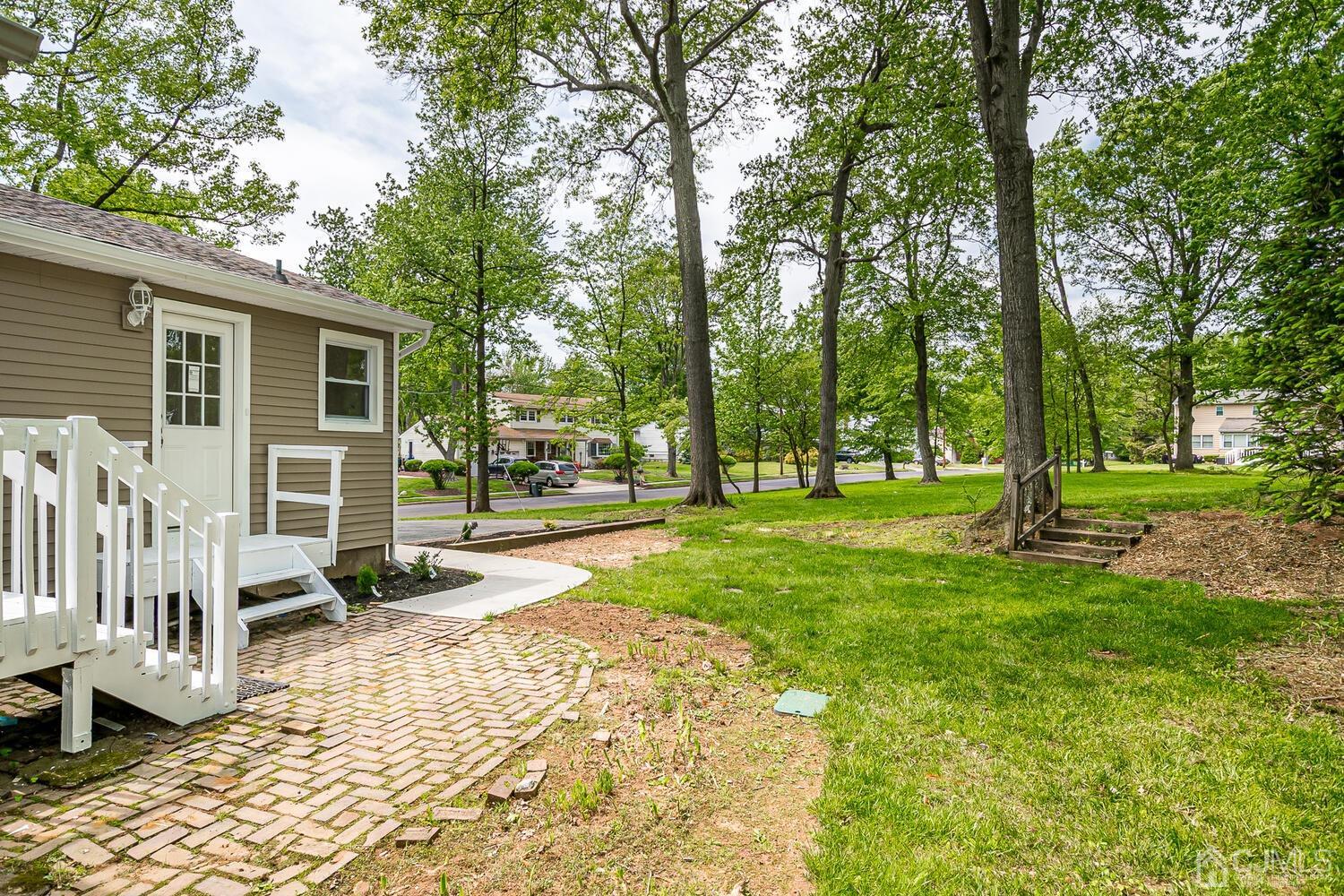 2 Devon Road Edison, NJ 08820 - Photo 65 of 69 a view of a house with backyard and a tree