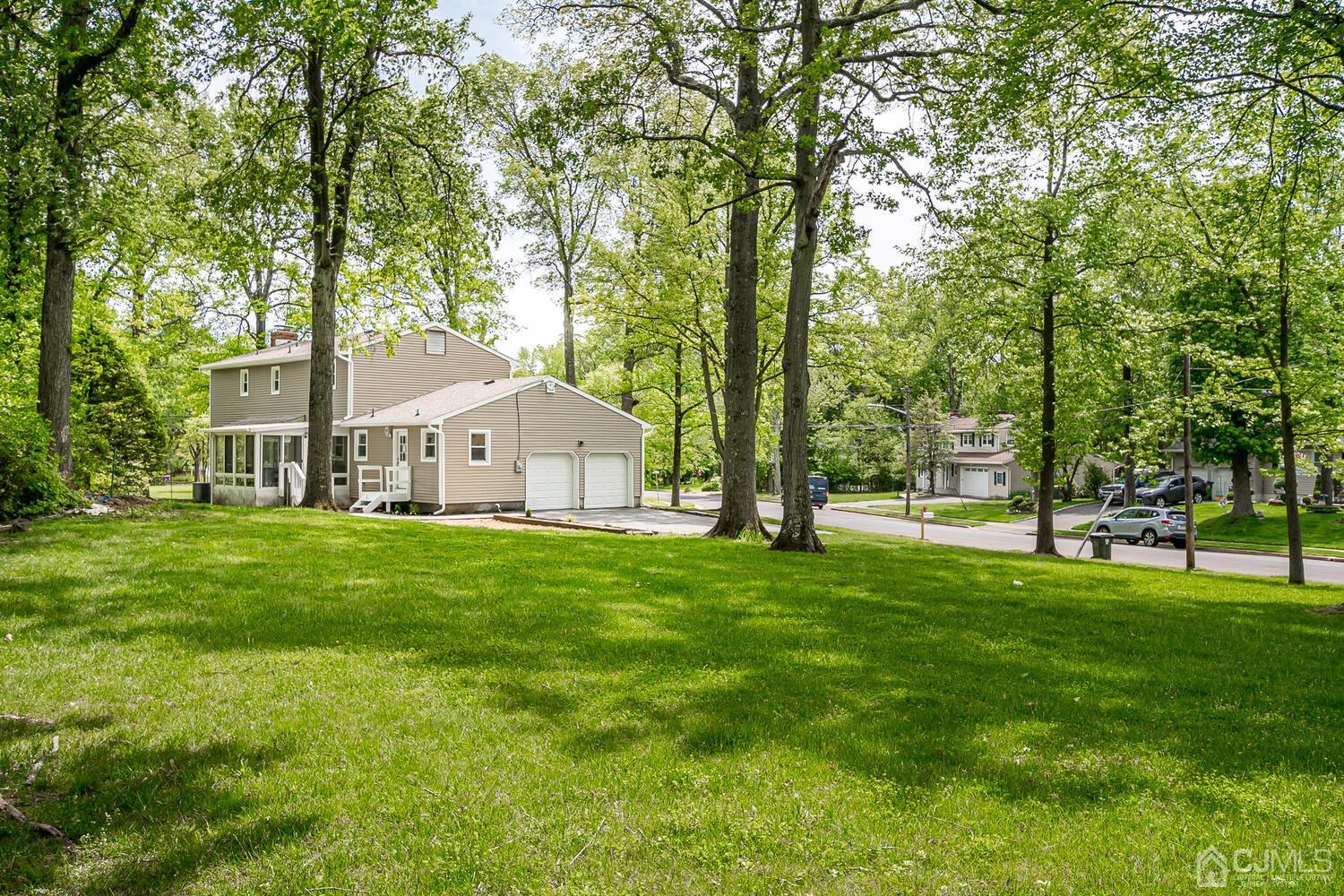 2 Devon Road Edison, NJ 08820 - Photo 66 of 69 a front view of a house with a garden