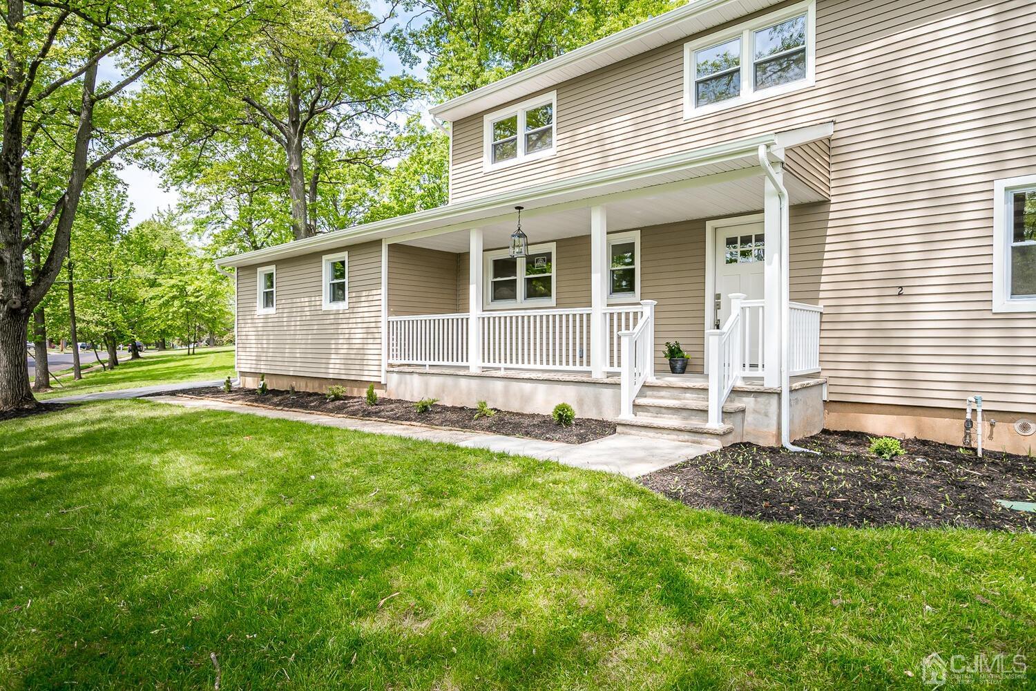2 Devon Road Edison, NJ 08820 - Photo 10 of 69 a house that has a big yard in front of it