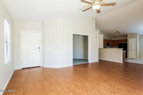 a view of a kitchen with a dishwasher cabinets and wooden floor