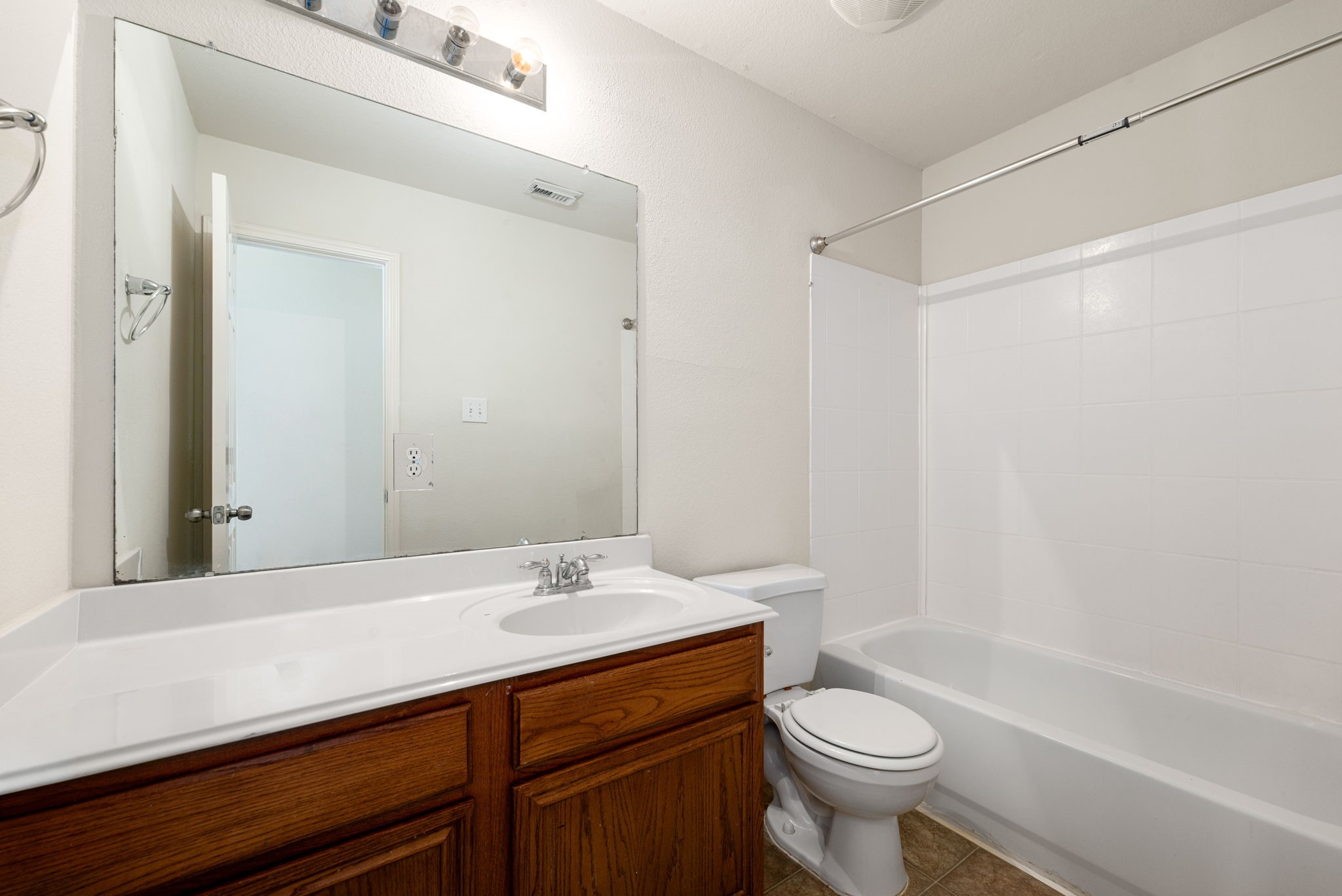 20927 Roxette Court Humble, TX 77338 - Photo 14 of 19 This secondary bath features a vanity and a tub/shower combo, convenient for family or guests.