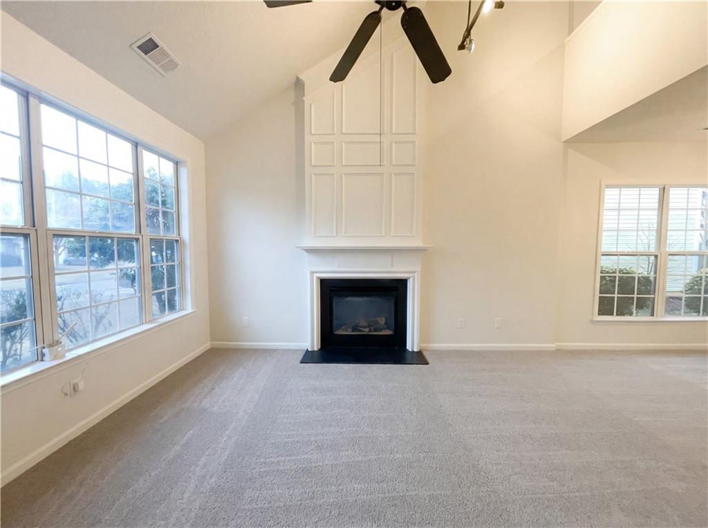 1639 Woodsford Road Kennesaw, GA 30152 - Photo 2 of 31 a view of an empty room with a window and fireplace