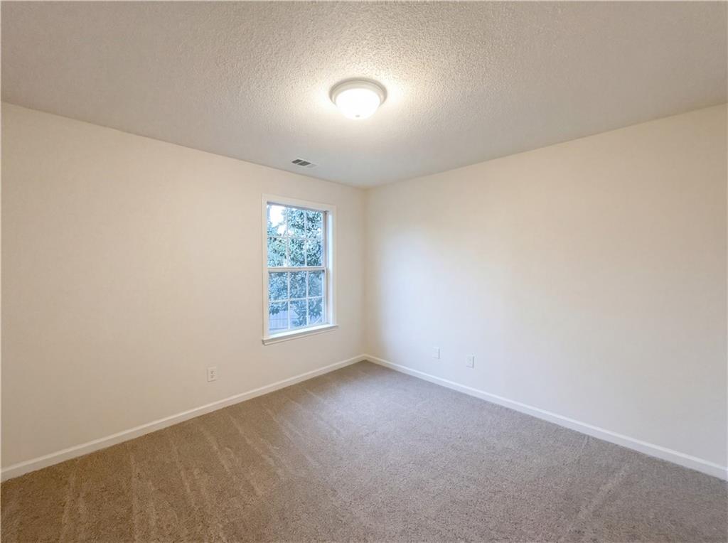 1639 Woodsford Road Kennesaw, GA 30152 - Photo 21 of 31 an empty room with a window