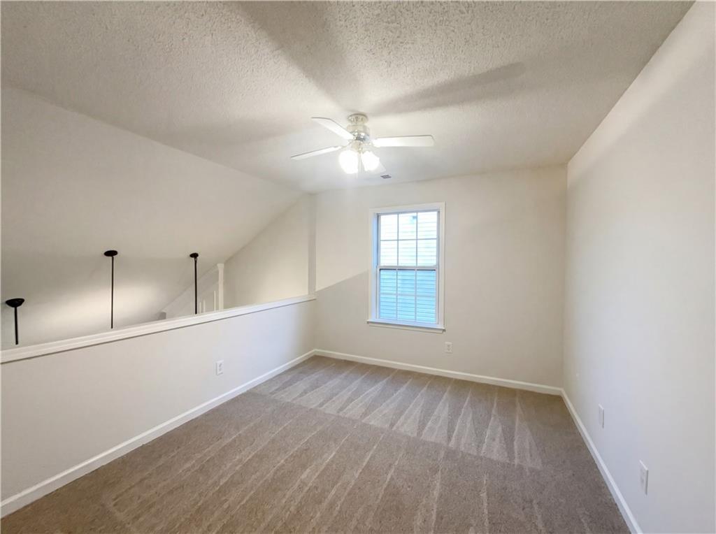 1639 Woodsford Road Kennesaw, GA 30152 - Photo 23 of 31 wooden floor in an empty room with a window
