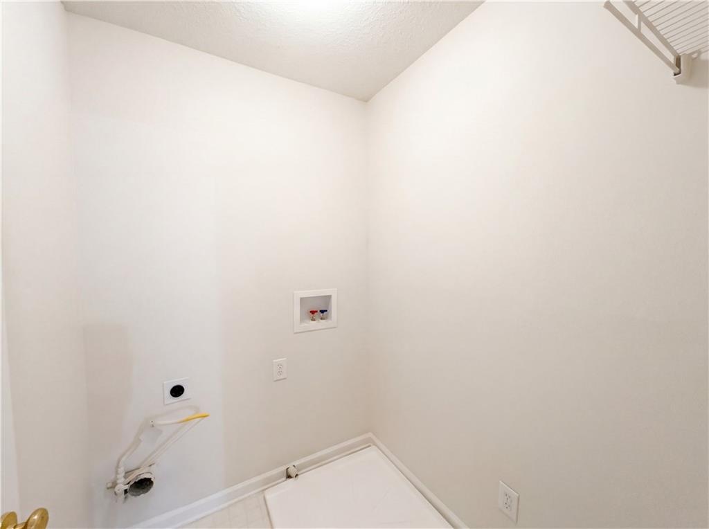 1639 Woodsford Road Kennesaw, GA 30152 - Photo 24 of 31 a bathroom with a toilet and a shower