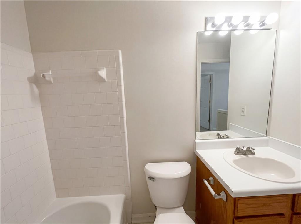 1639 Woodsford Road Kennesaw, GA 30152 - Photo 26 of 31 a bathroom with a sink toilet and shower