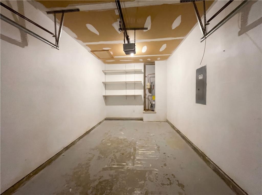 1639 Woodsford Road Kennesaw, GA 30152 - Photo 27 of 31 a view of storage and utility room with wooden floor