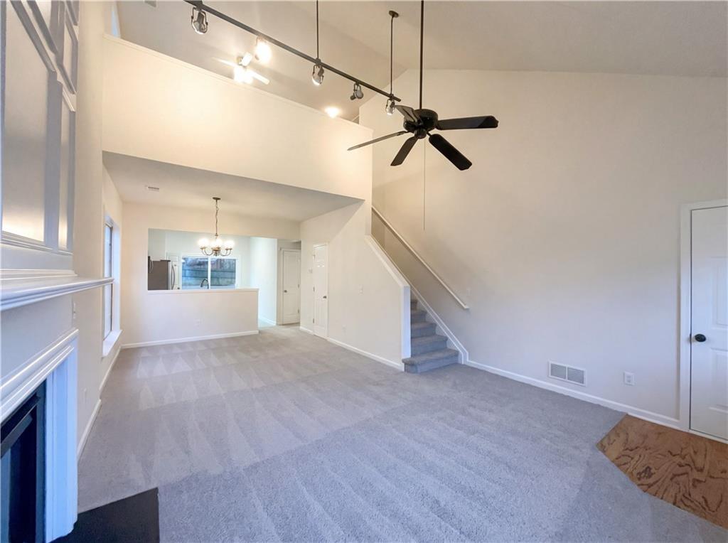 1639 Woodsford Road Kennesaw, GA 30152 - Photo 7 of 31 a view of empty room with wooden floor and fan