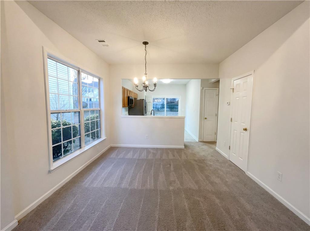 1639 Woodsford Road Kennesaw, GA 30152 - Photo 9 of 31 a view of a room with wooden floor and windows