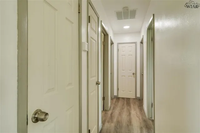 a view of a bathroom from a hallway