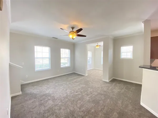 a view of an empty room with a window