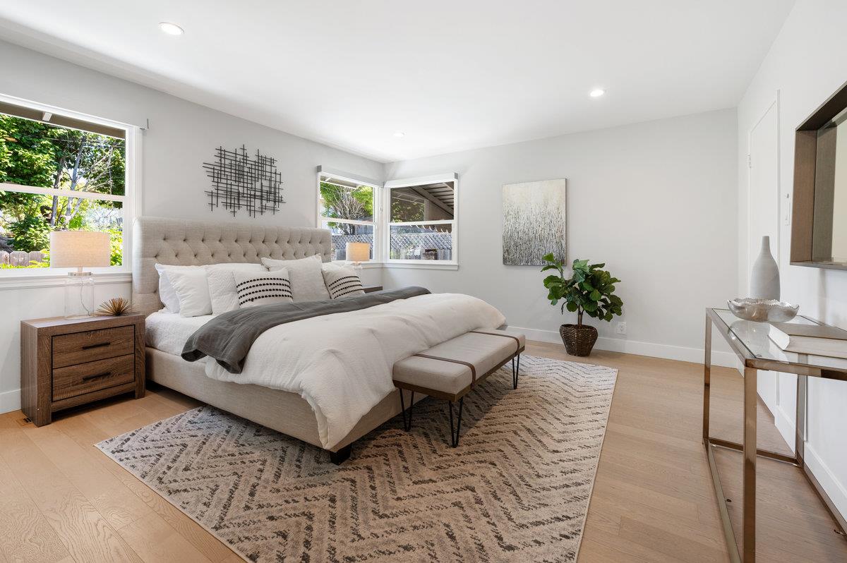 545 Alhambra Road San Mateo, CA 94402 - Photo 29 of 59 a bedroom with a large bed and a couch