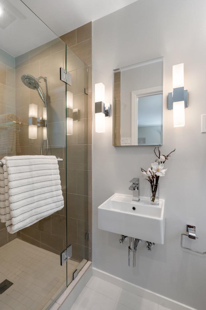 545 Alhambra Road San Mateo, CA 94402 - Photo 30 of 59 a bathroom with a sink and a mirror