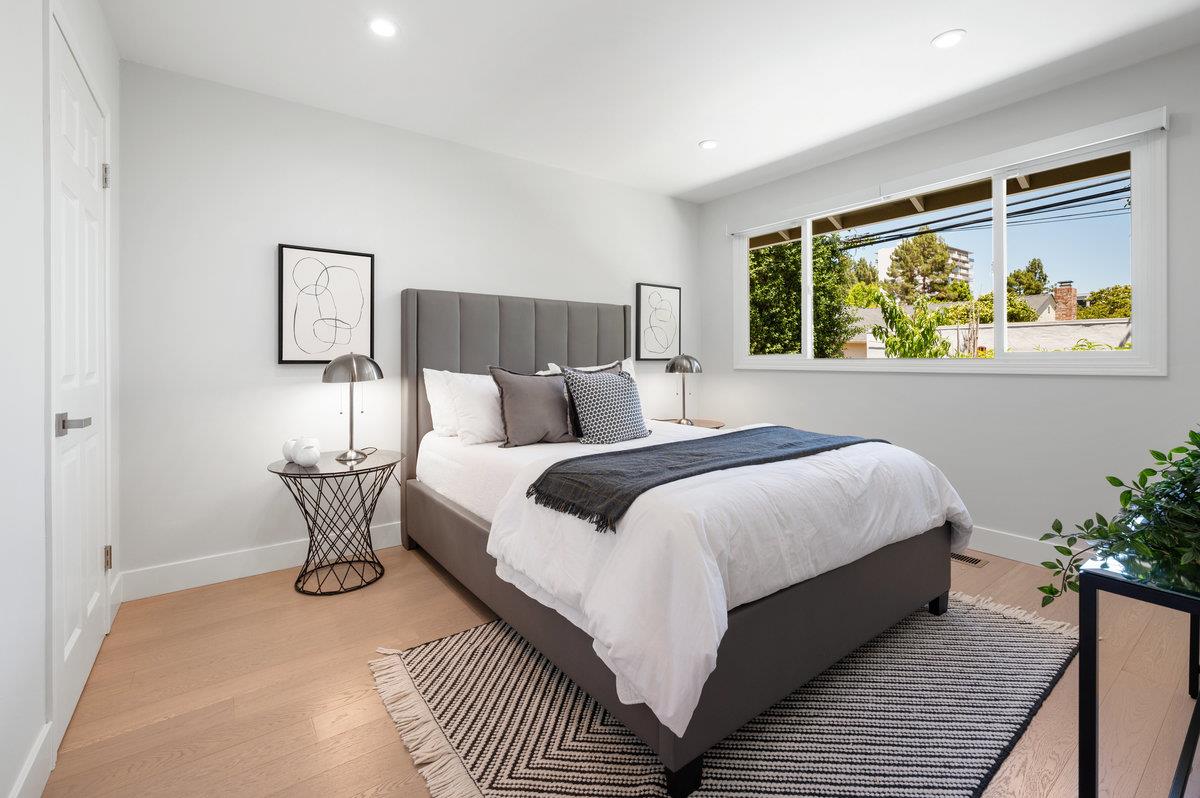 545 Alhambra Road San Mateo, CA 94402 - Photo 34 of 59 a bedroom with a bed and a painting on the wall