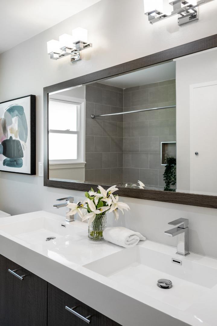 545 Alhambra Road San Mateo, CA 94402 - Photo 35 of 59 a bathroom with a sink and a mirror