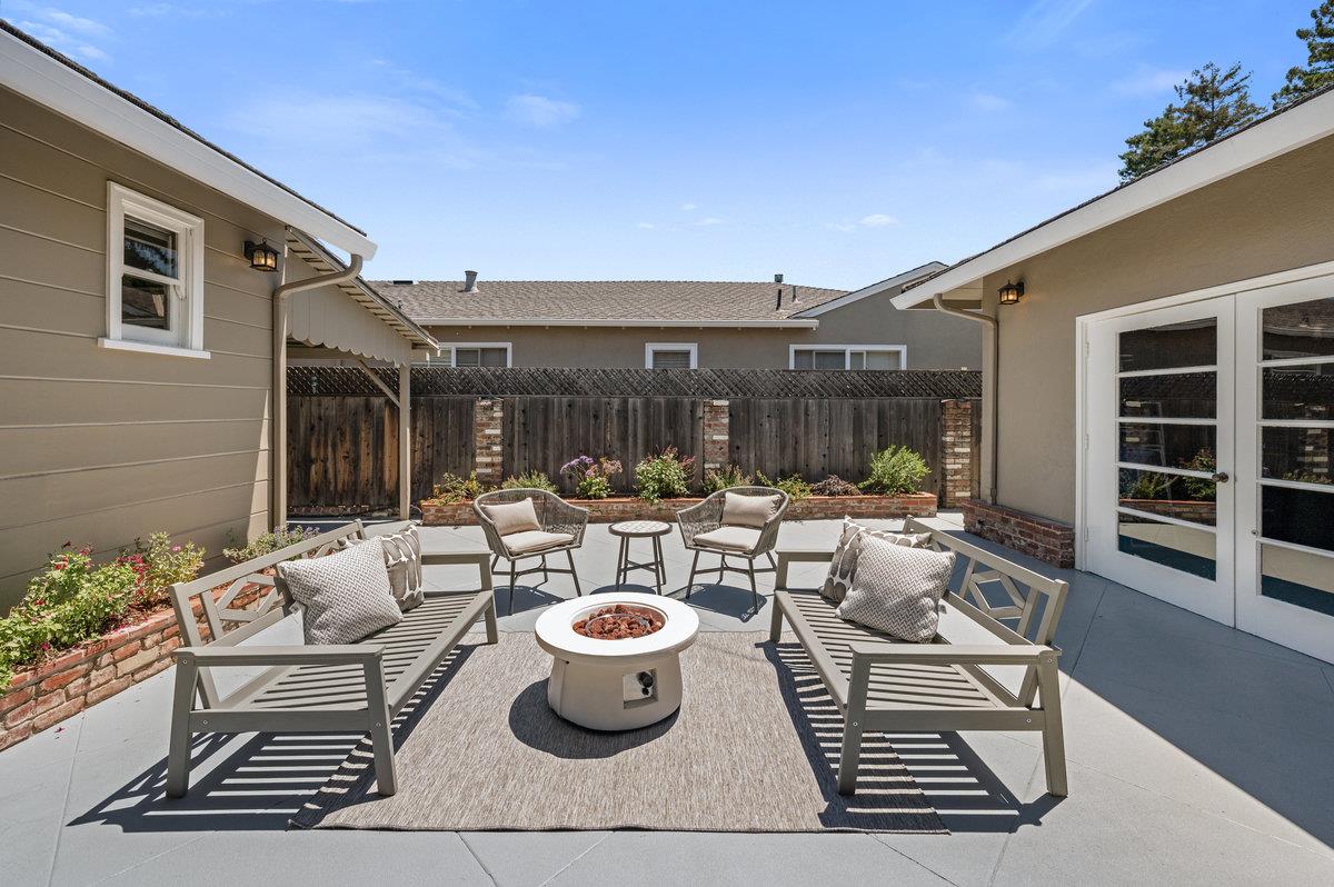 545 Alhambra Road San Mateo, CA 94402 - Photo 39 of 59 a view of a patio with couches table and chairs and potted plants