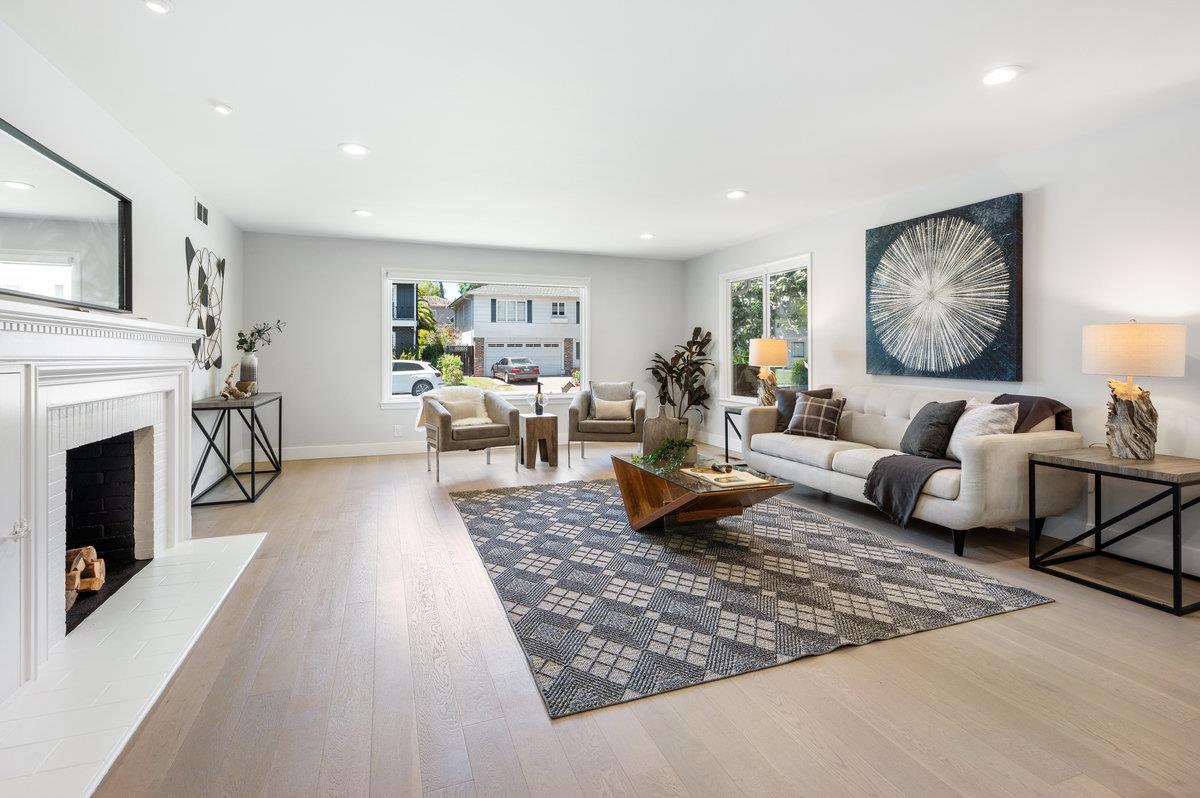 545 Alhambra Road San Mateo, CA 94402 - Photo 5 of 59 a living room with furniture and a fireplace