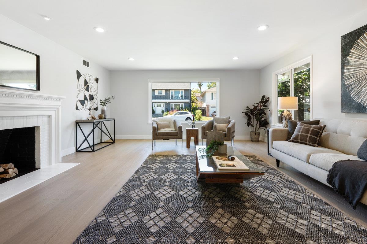 545 Alhambra Road San Mateo, CA 94402 - Photo 6 of 59 a living room with furniture and a fireplace