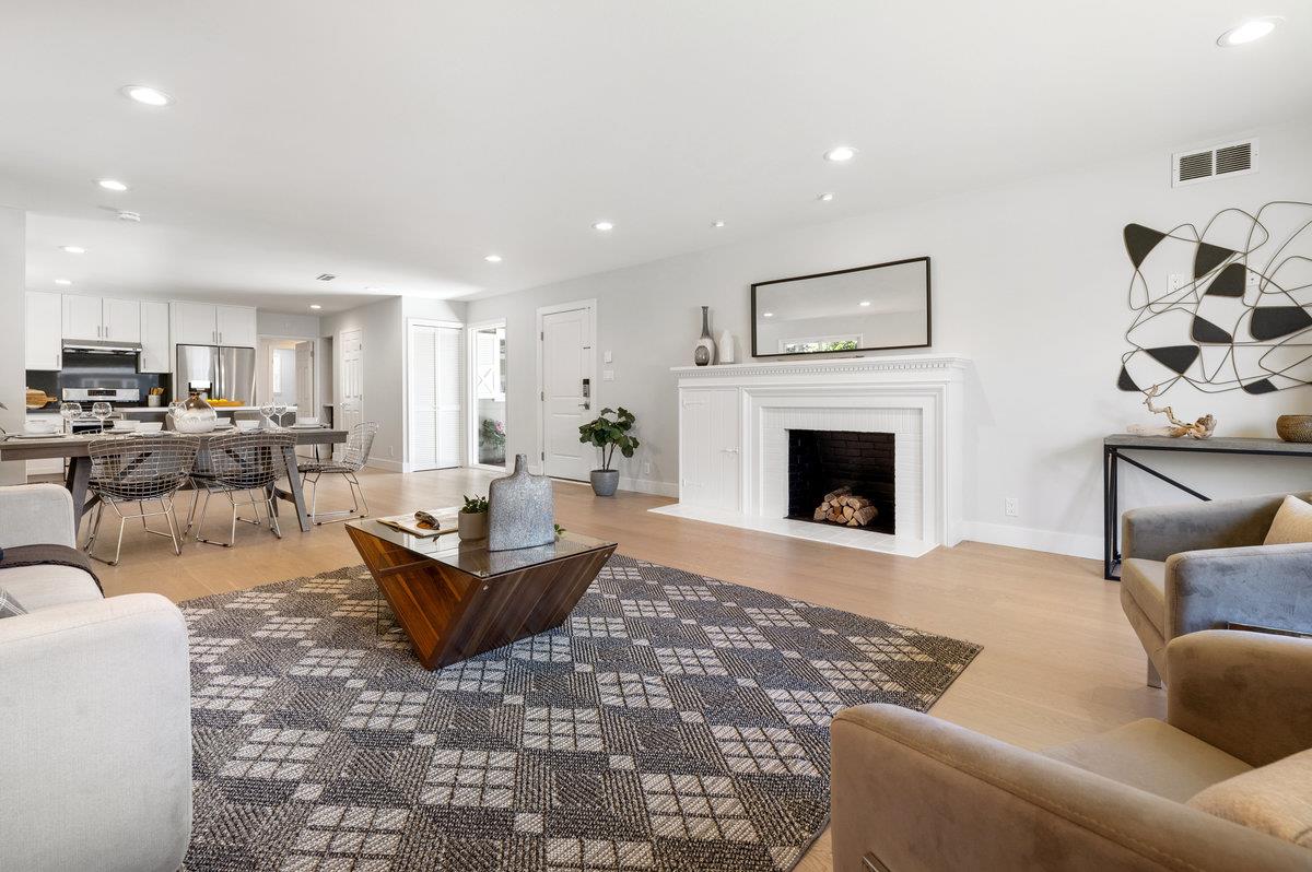 545 Alhambra Road San Mateo, CA 94402 - Photo 8 of 59 a living room with furniture and a fireplace