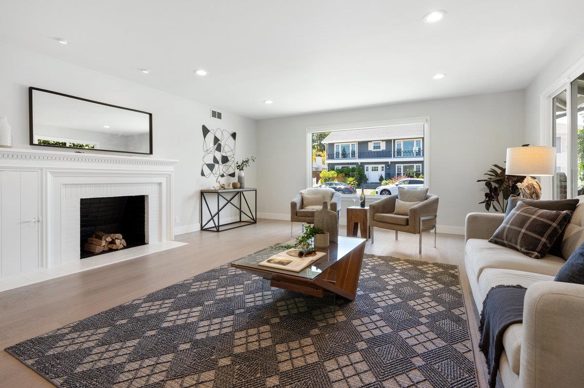545 Alhambra Road San Mateo, CA 94402 - Photo 9 of 59 a living room with furniture and a fireplace