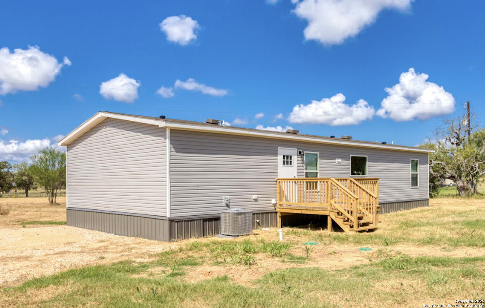 Tbd County Road 769 Devine, TX 78016 - Photo 4 of 12 a view of a house with a yard
