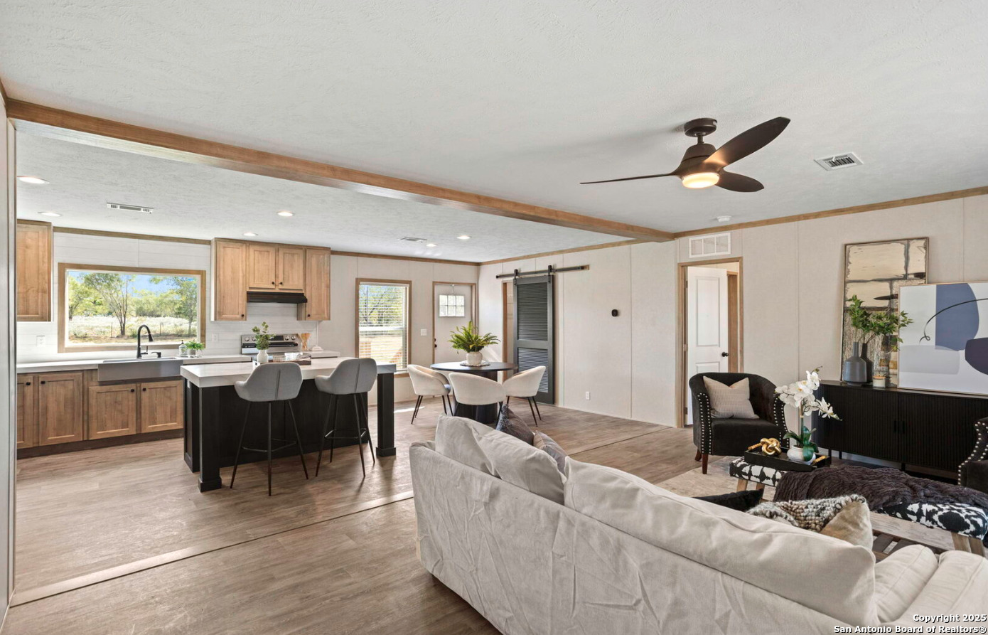 Tbd County Road 769 Devine, TX 78016 - Photo 6 of 12 a living room with furniture two window and a flat screen tv