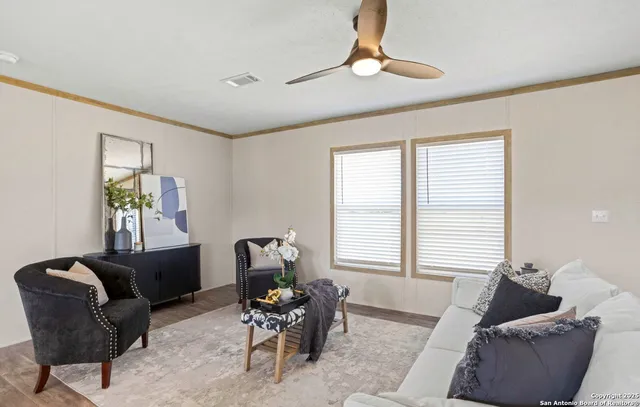 a living room with furniture and window