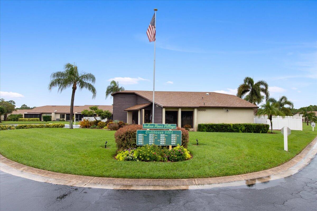 6006 Indrio Road, Unit 7 Fort Pierce, FL 34951 - Photo 28 of 31 a view of a house with a garden and plants