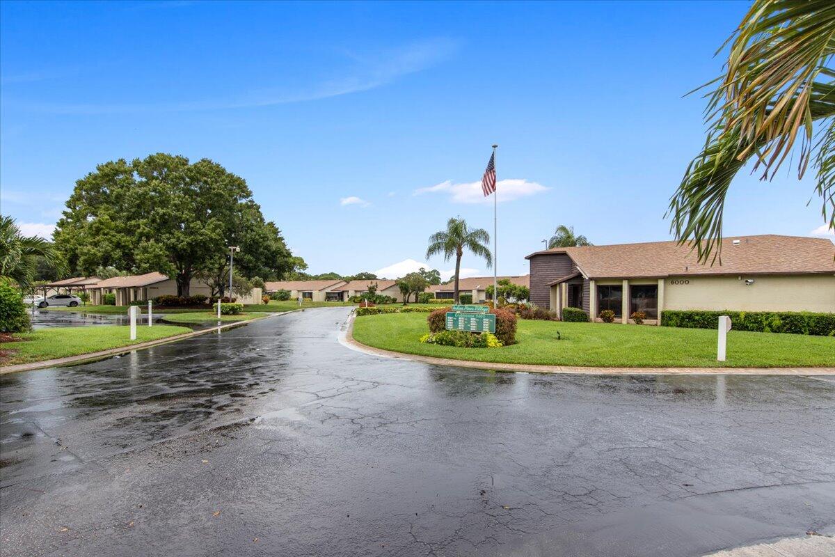 6006 Indrio Road, Unit 7 Fort Pierce, FL 34951 - Photo 29 of 31 a front view of a house with a yard