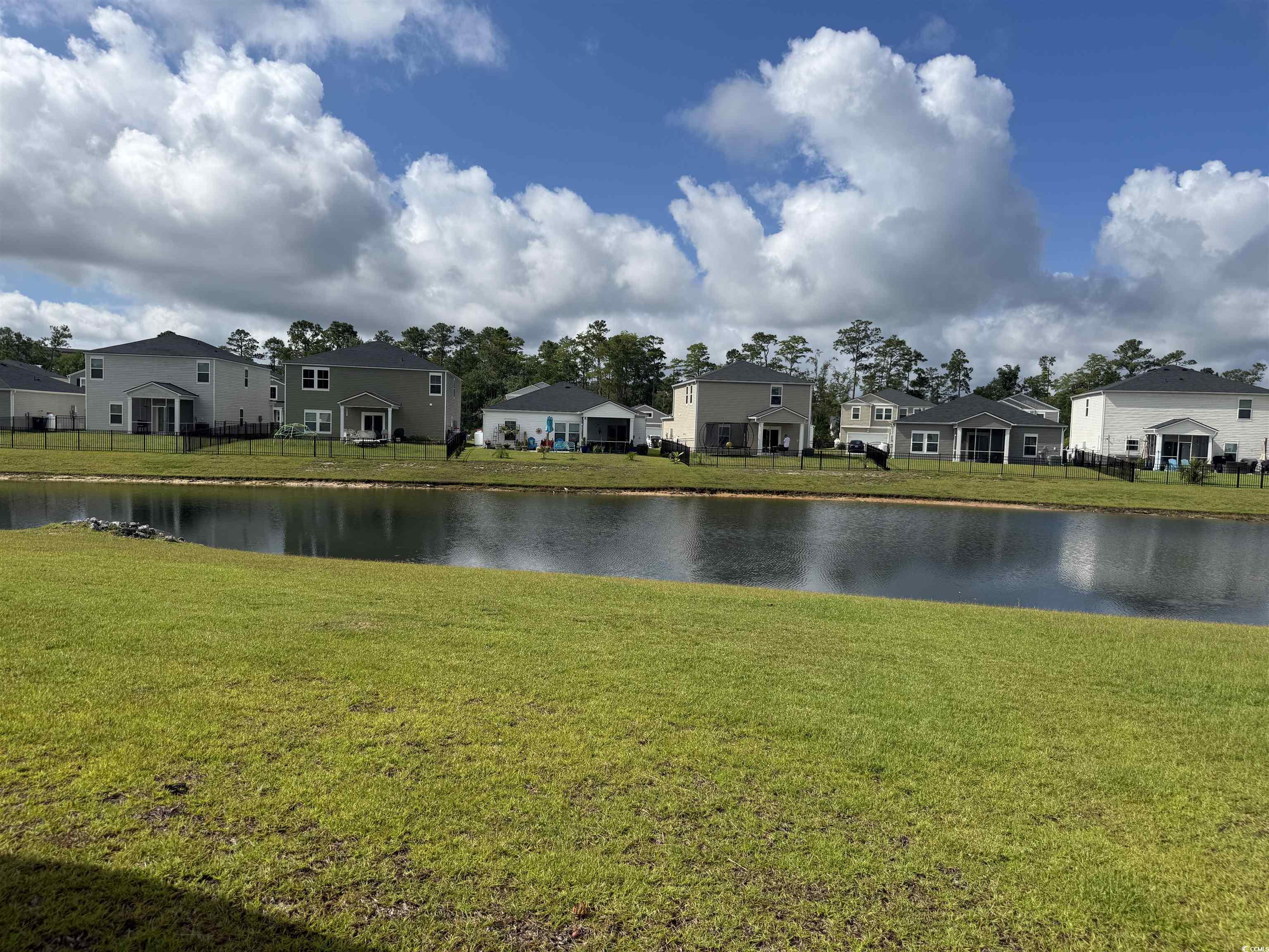Water view with nearby suburban area