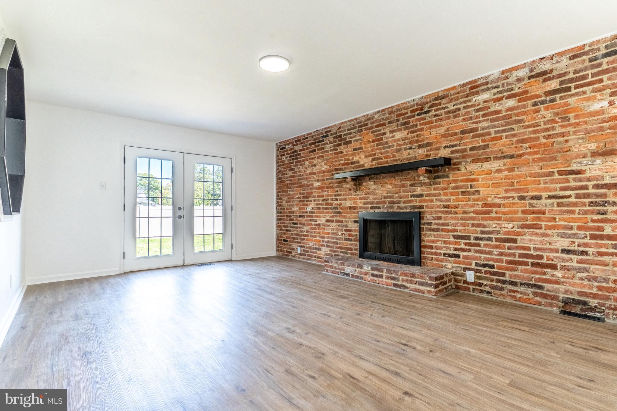 5 Ramsgate Road Cherry Hill, NJ 08003 - Photo 12 of 35 a view of an empty room with wooden floor and a fireplace