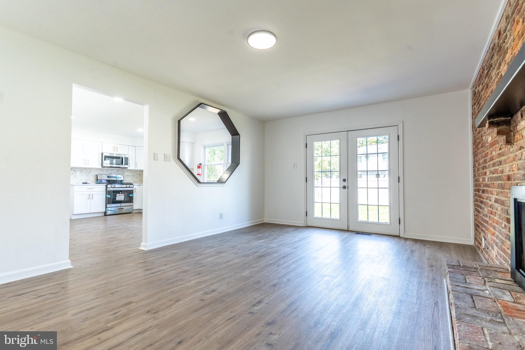 5 Ramsgate Road Cherry Hill, NJ 08003 - Photo 14 of 35 an empty room with wooden floor mirror and windows