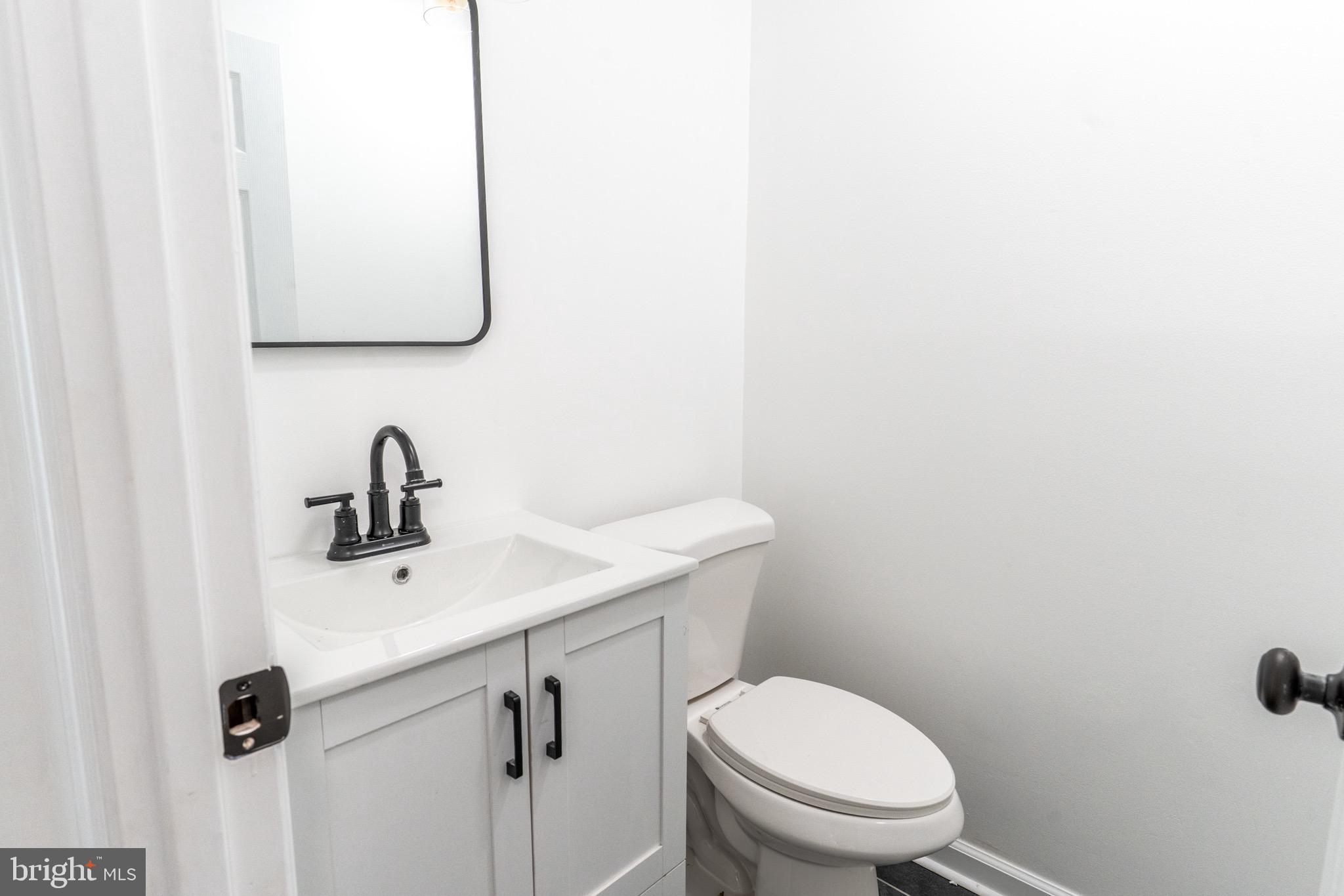 5 Ramsgate Road Cherry Hill, NJ 08003 - Photo 15 of 35 a bathroom with a toilet sink and mirror