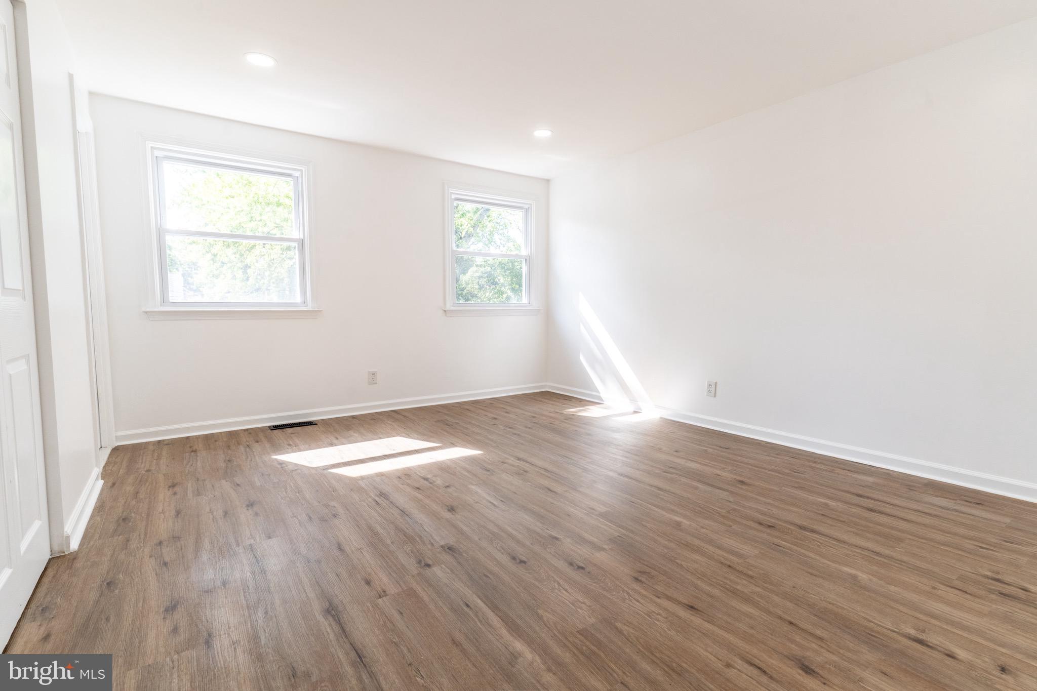 5 Ramsgate Road Cherry Hill, NJ 08003 - Photo 18 of 35 an empty room with wooden floor and windows