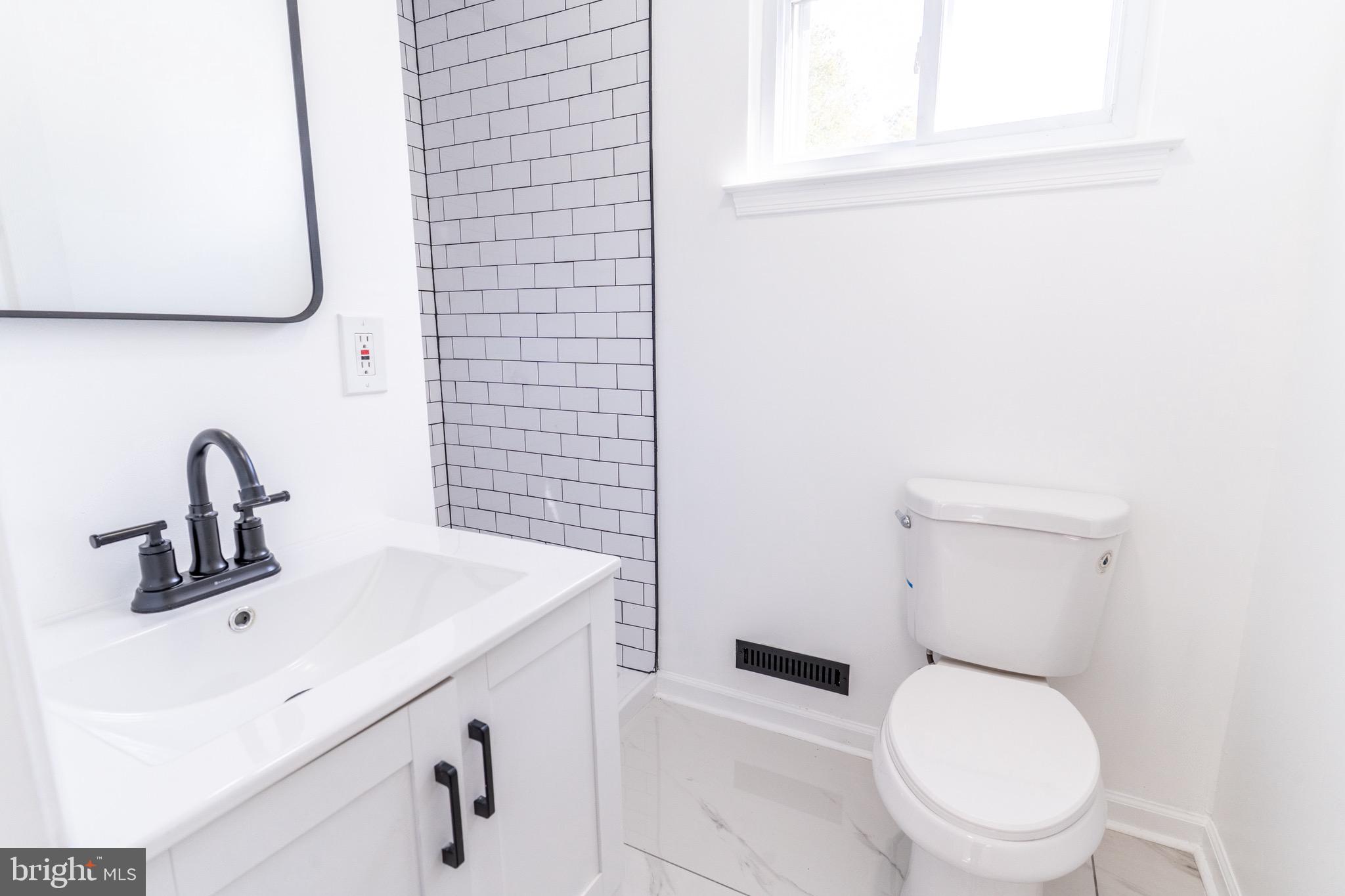5 Ramsgate Road Cherry Hill, NJ 08003 - Photo 20 of 35 a bathroom with a sink a toilet and mirror