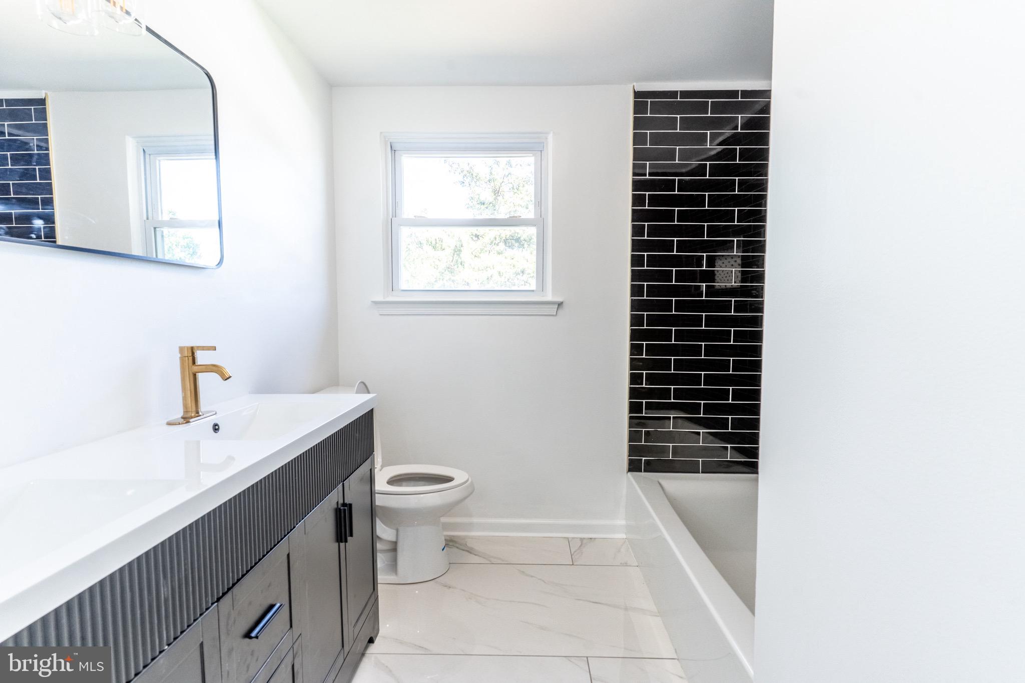 5 Ramsgate Road Cherry Hill, NJ 08003 - Photo 28 of 35 a bathroom with a sink a toilet and shower