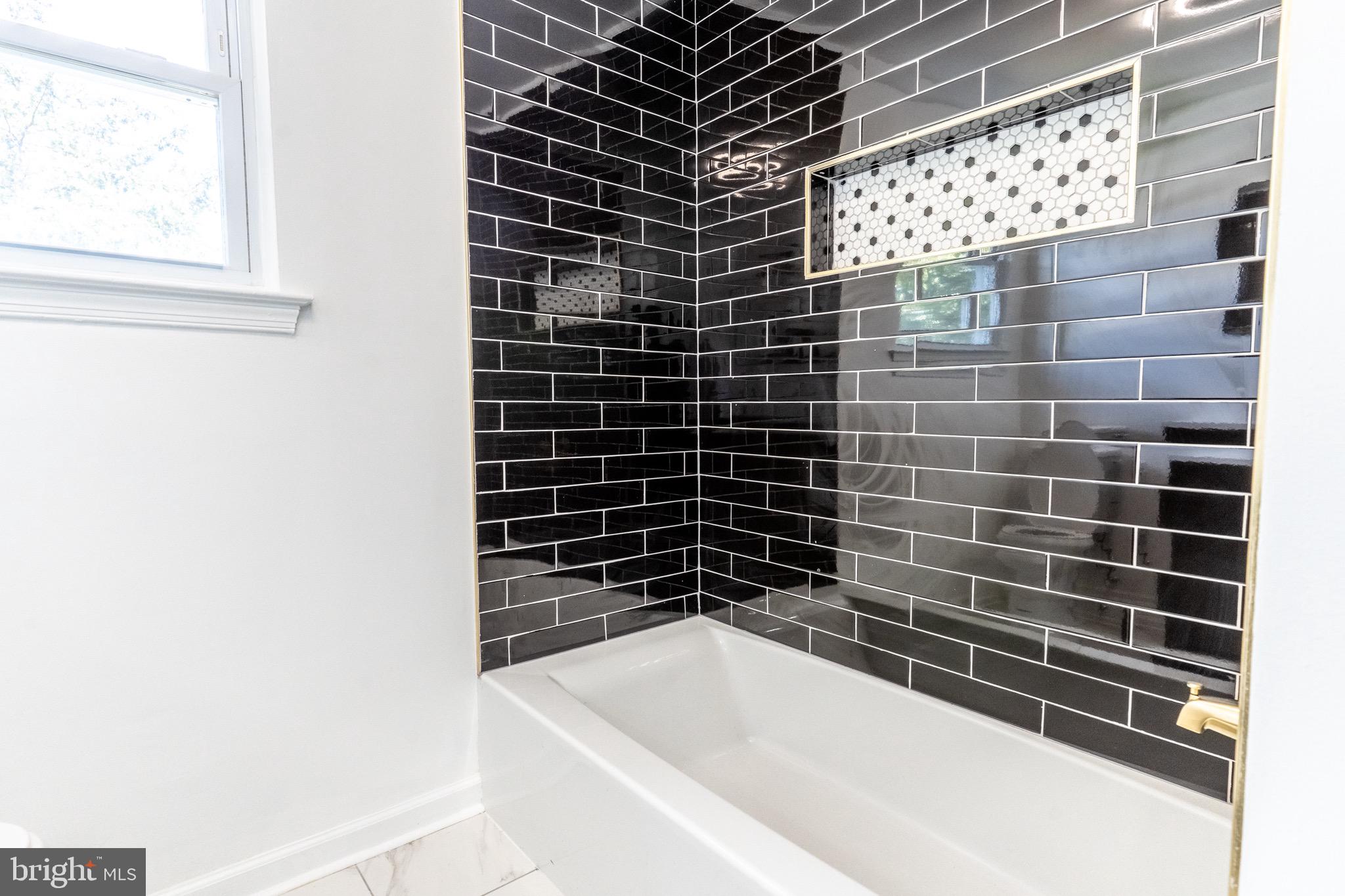 5 Ramsgate Road Cherry Hill, NJ 08003 - Photo 30 of 35 a bathroom with a bathtub and a shower