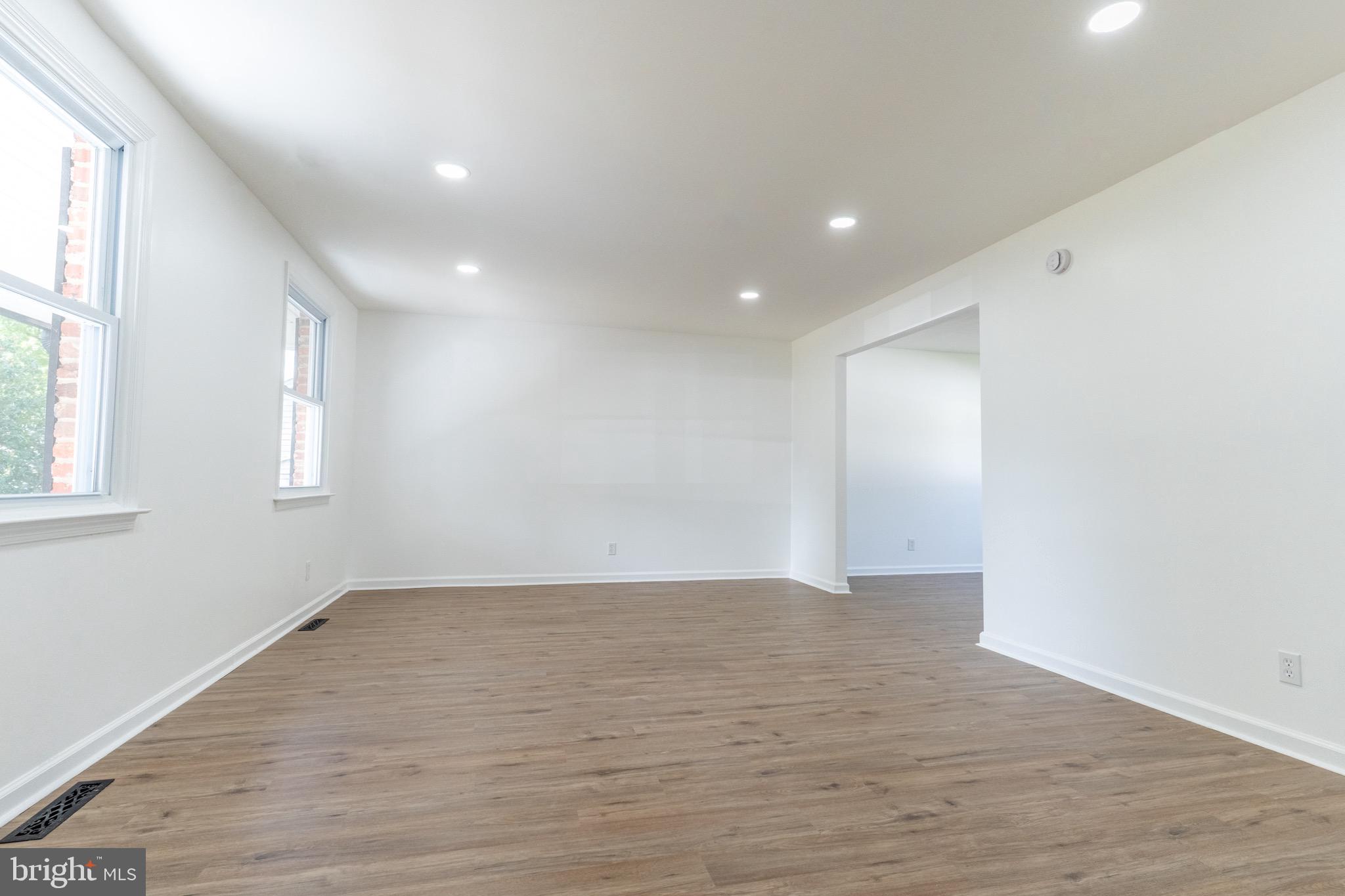 5 Ramsgate Road Cherry Hill, NJ 08003 - Photo 4 of 35 a view of an empty room with wooden floor and a window