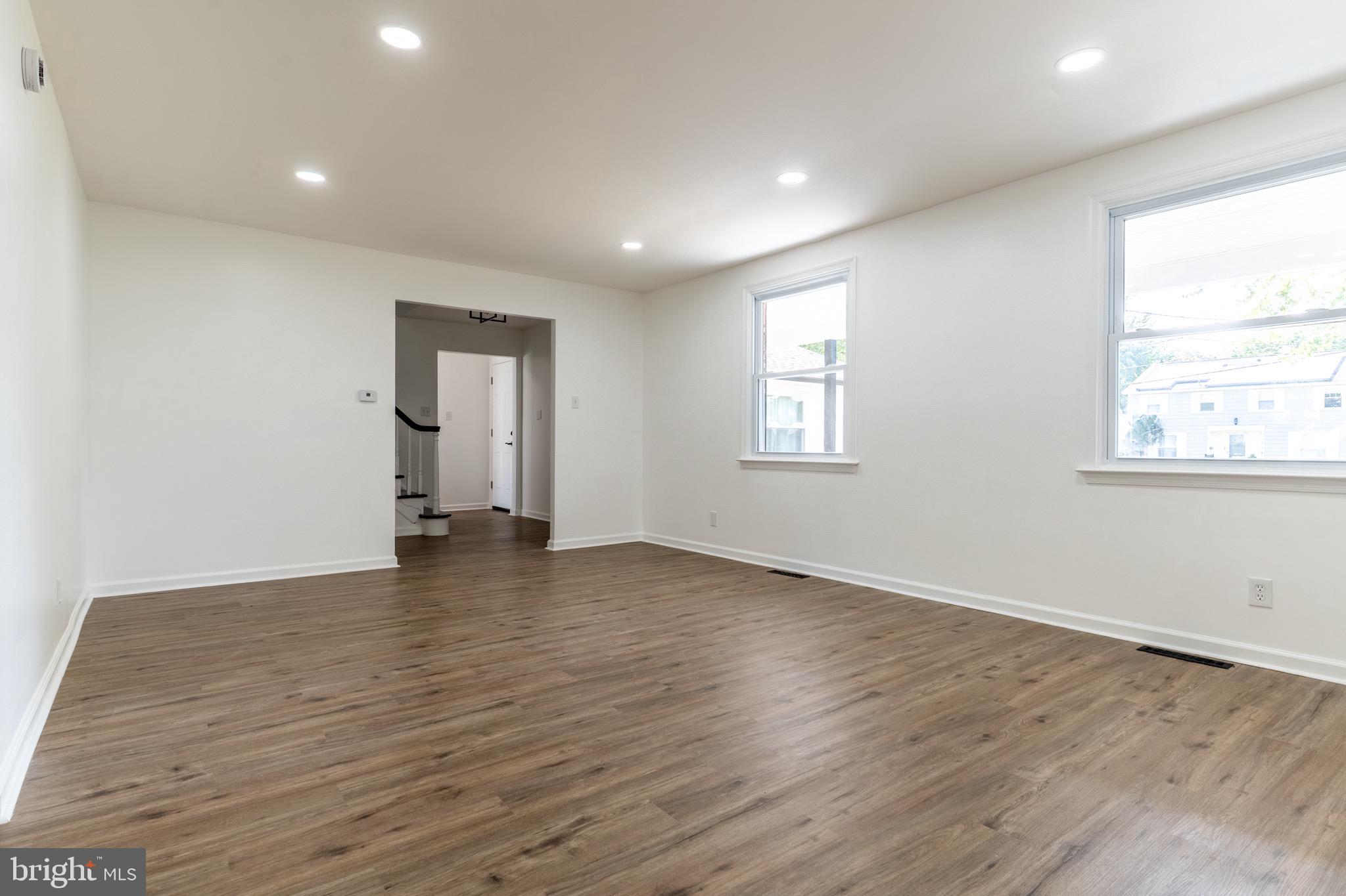 5 Ramsgate Road Cherry Hill, NJ 08003 - Photo 6 of 35 an empty room with wooden floor and windows