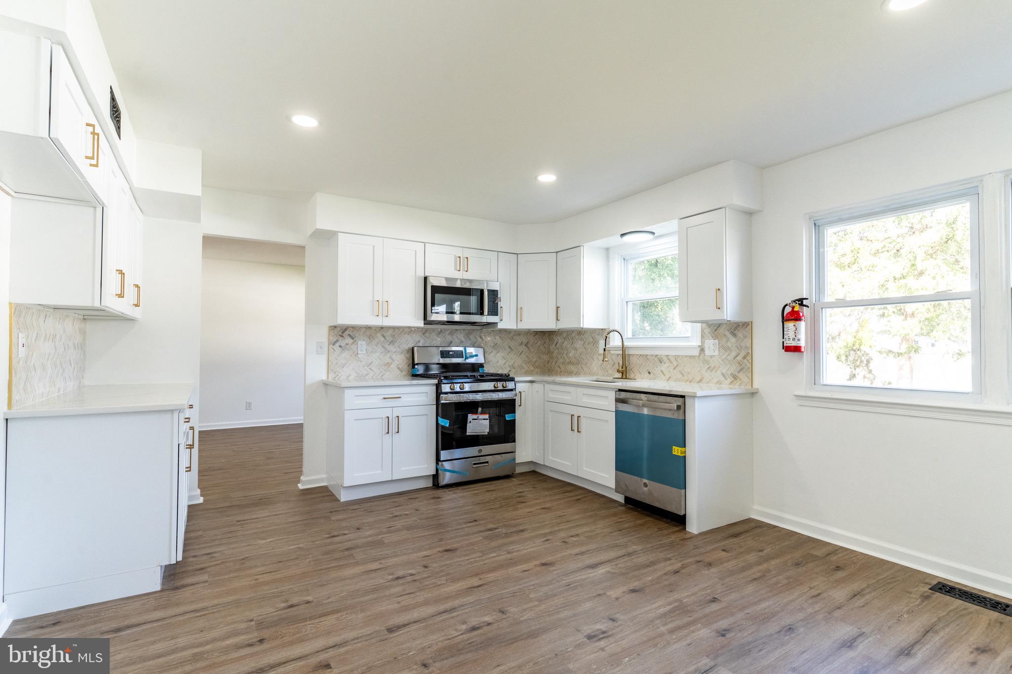 5 Ramsgate Road Cherry Hill, NJ 08003 - Photo 8 of 35 a kitchen with a white wooden cabinets and window