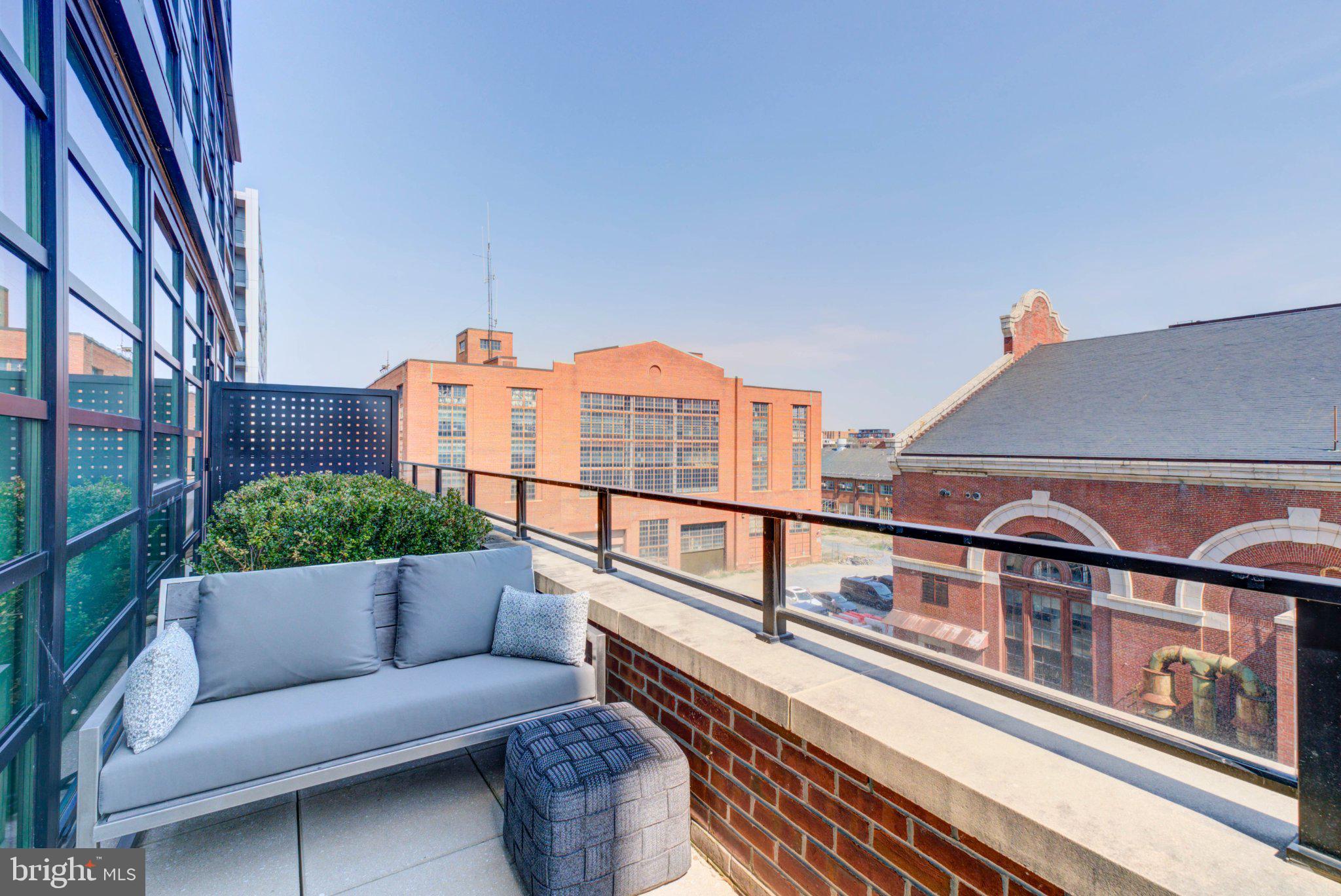 1300 4th Street Southeast, Unit 414 Washington, DC 20003 - Photo 4 of 19 a view of a balcony with furniture
