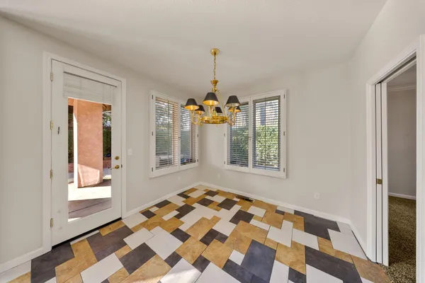 a view of a living room and kitchen