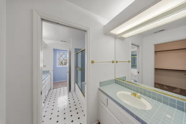 a bathroom with a bathtub and shower