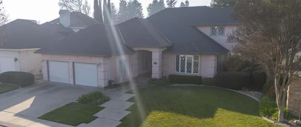a front view of a house with garden