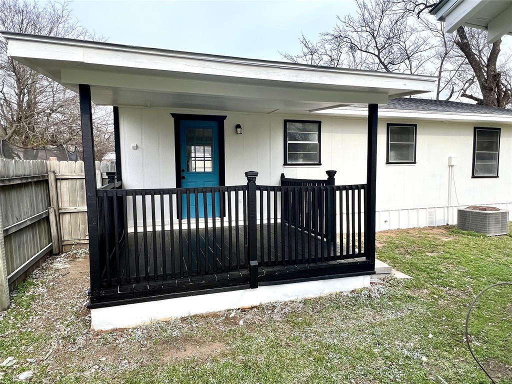 406 East Brazos Street Groesbeck, TX 76642 - Photo 26 of 29 a view of a house with a wooden fence
