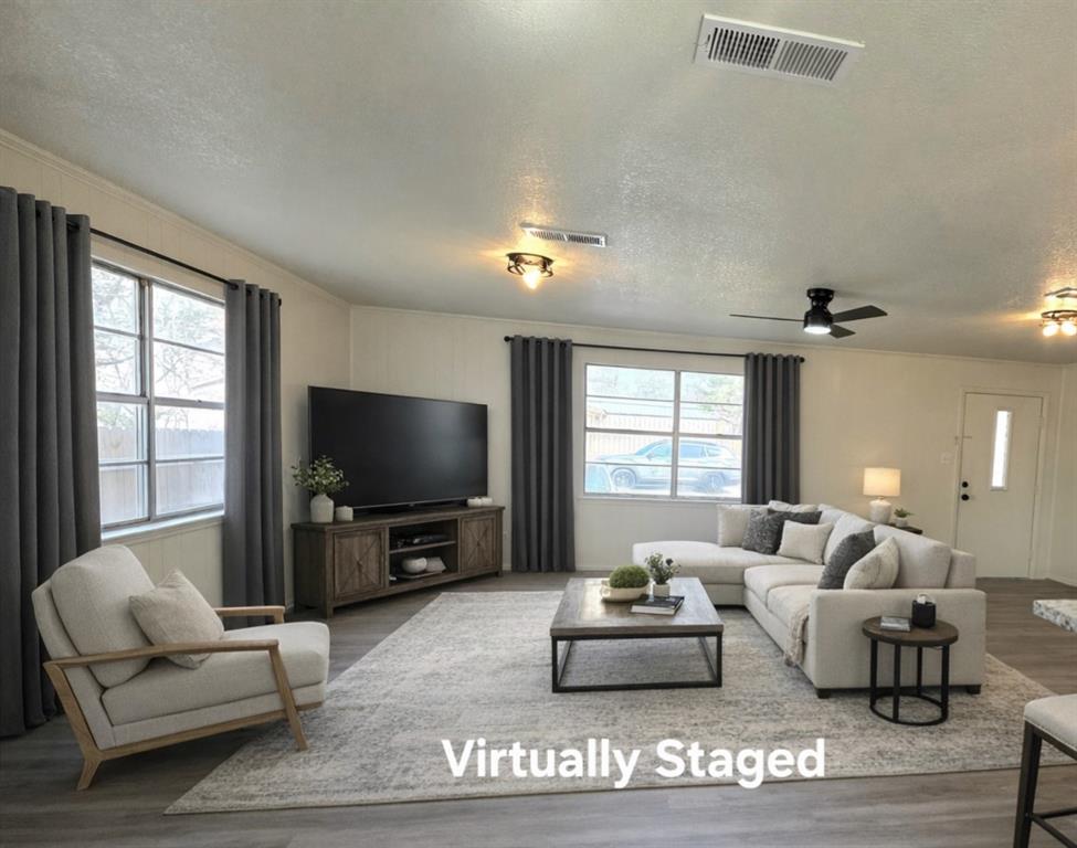 406 East Brazos Street Groesbeck, TX 76642 - Photo 6 of 29 a living room with furniture and a flat screen tv