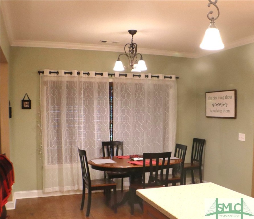 479 Shearouse Road Guyton, GA 31312 - Photo 12 of 32 Breakfast Area overlooks screened porch and the gr